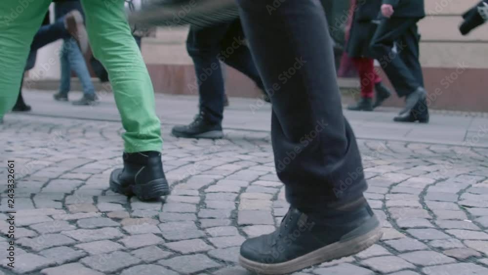 Brno, Czech Republic – 01/07/2019: International Silly Walk Day. Strange steps of fooling walks on banter march. Funny procession of people having fun with up-and-down gait. Quaint way of walking Brno, Czech Republic – 01/07/2019: International Silly Walk Day. Strange steps of fooling walks on banter march. Funny procession of people having fun with up-and-down gait. Quaint way of walking