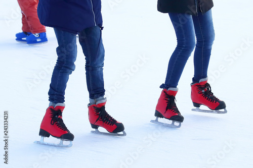 people skating on the ice rink