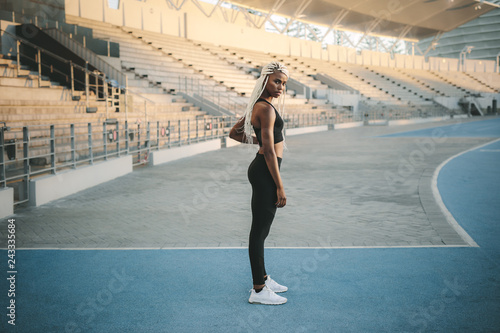 Athlete standing near the stands in a stadium © Jacob Lund