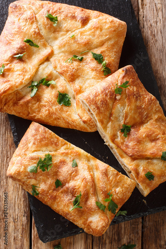 Khachapuri is a traditional Georgian dish of cheese-filled bread. The filling contains cheese sulguni, eggs Vertical top view