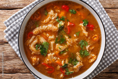 Flaki or flaczki is a traditional Polish meat stew close-up in a bowl. horizontal top view