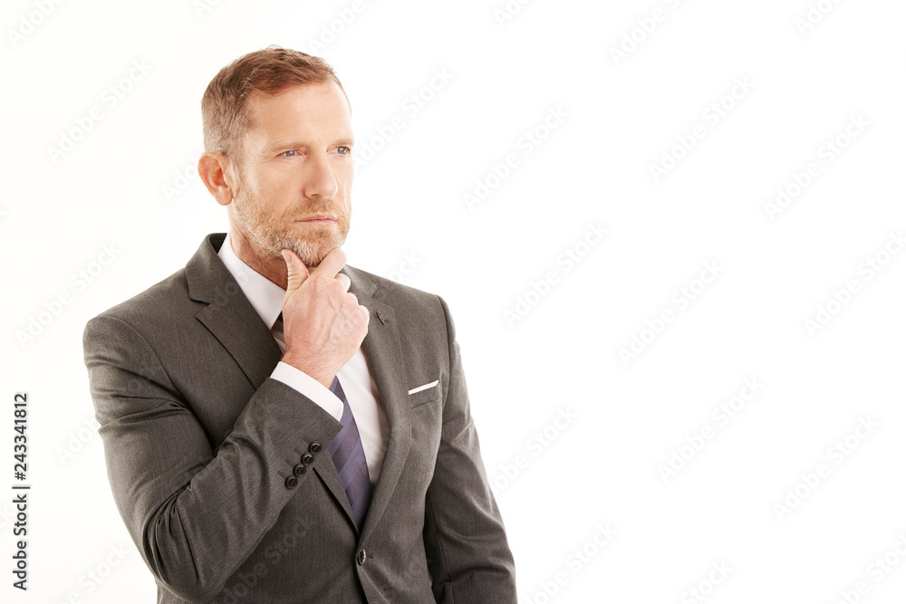 Businessman deep in thought. Man standing against white background Businessman deep in thought. Man standing against white background