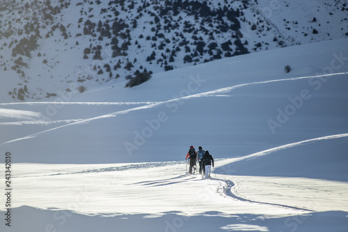 skiers go uphill, ski tour