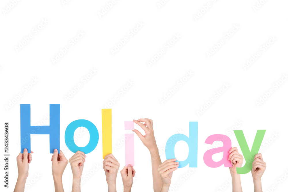 Hands holding the word Holiday on white background Hands holding the word Holiday on white background