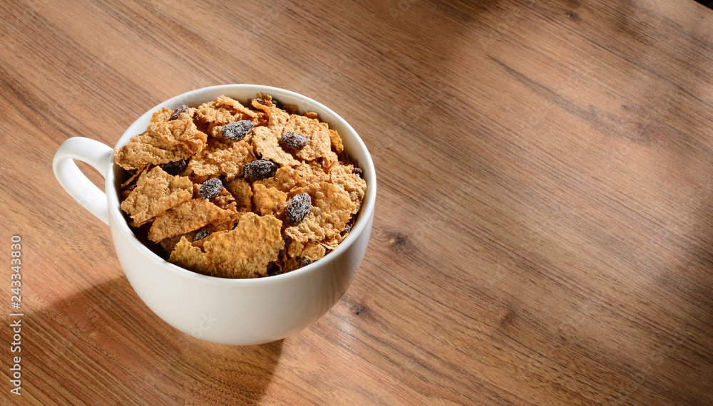 Raisin and flake cereal . Raisin and flake cereal .