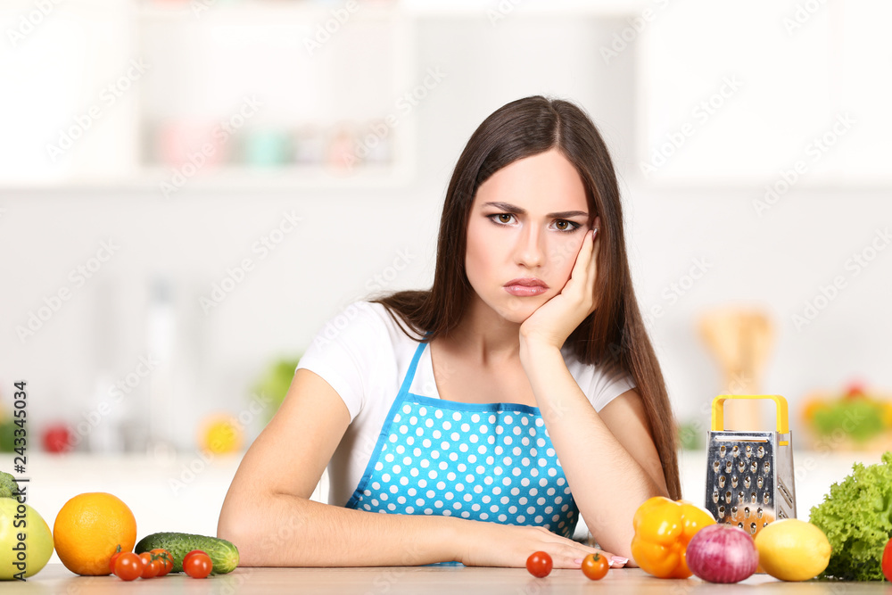 Beautiful woman cooking food in the kitchen Beautiful woman cooking food in the kitchen