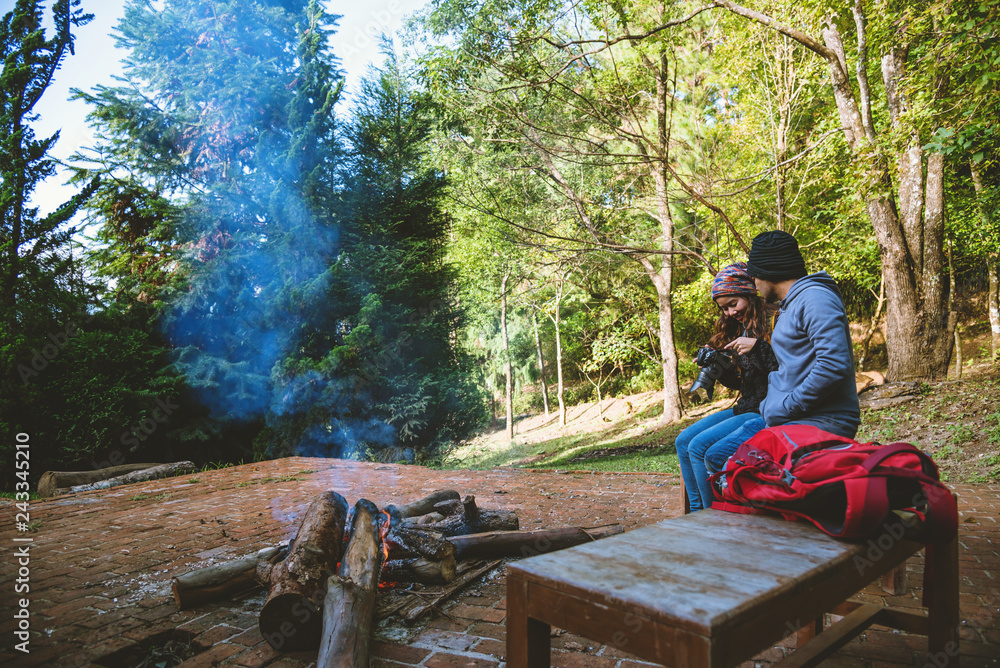Couple travel photograph nature on the mountains relax in the holiday. Romance lovers Camp Fire winter Couple travel photograph nature on the mountains relax in the holiday. Romance lovers Camp Fire winter