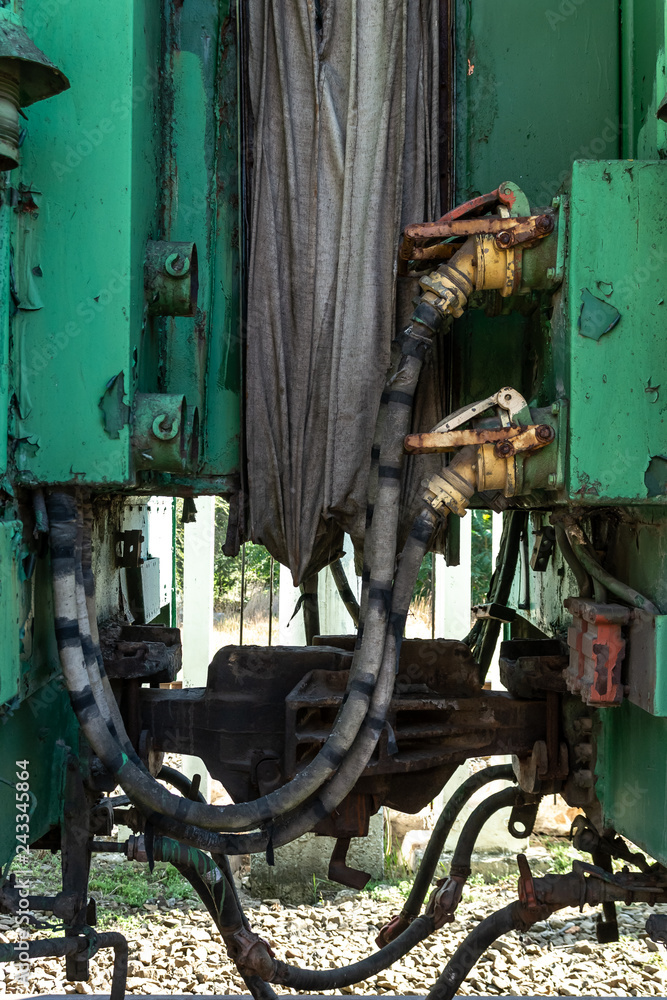 Vintage coupling between the railway wagons