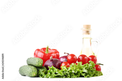 Fototapeta Naklejka Na Ścianę i Meble -  Fresh vegetables and oil in bottle isolated on white background