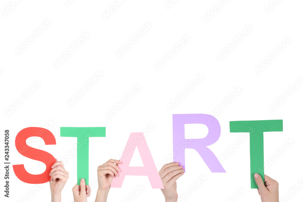 Hands holding the word Start on white background Hands holding the word Start on white background