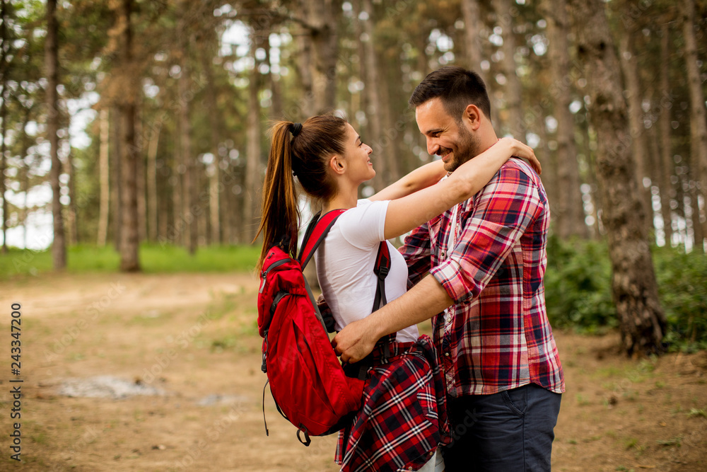 Fototapeta premium Loving coulpe having fun in the forest at spring time