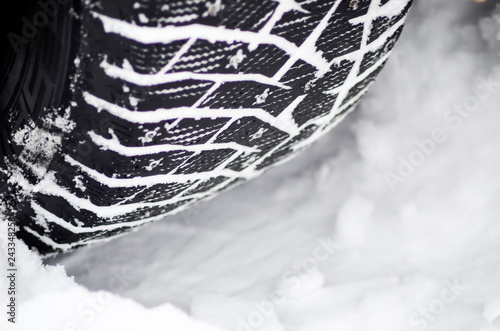 Winter tire with spikes in snow