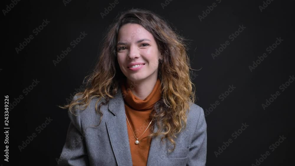 Closeup portrait of modern successful attractive female looking at camera nodding smiling and showing thumb up. Closeup portrait of modern successful attractive female looking at camera nodding smiling and showing thumb up.