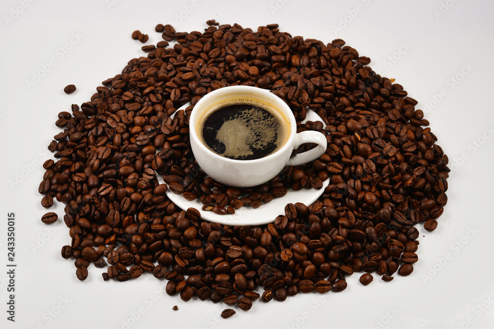 Cup of coffee and coffee beans. Cup of coffee and coffee beans.