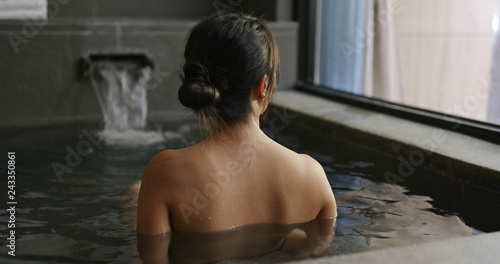 Woman enjoy onsen photo