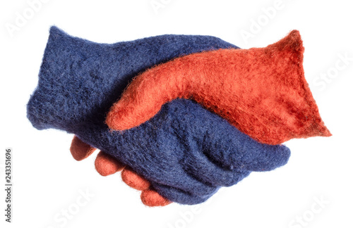 handshake of blue and orange gloves isolated