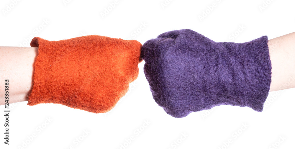 Fototapeta premium above view of fist bump of hands in color gloves