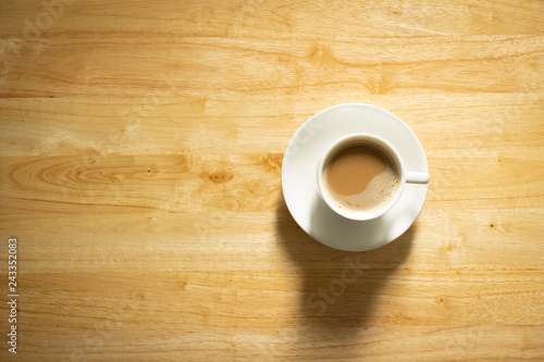 cup of coffee on wooden table