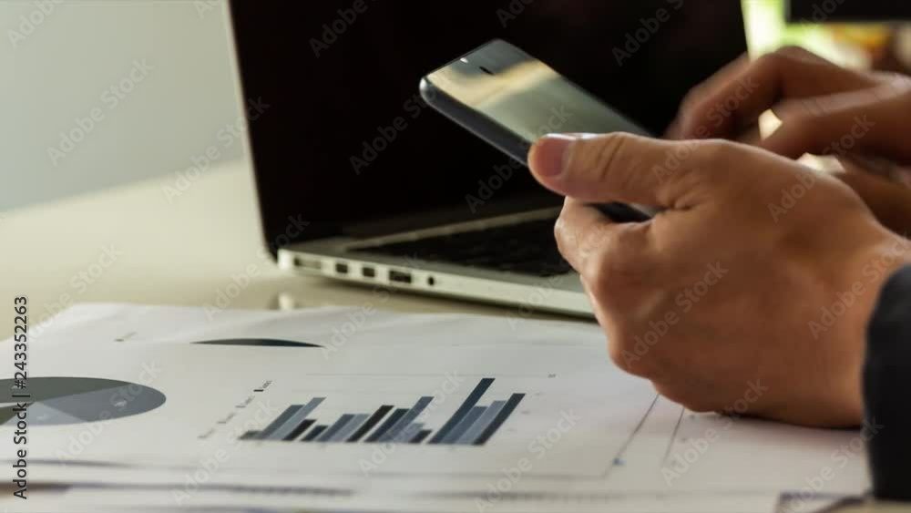 Manager working with report paper at office, checking on the chart , to imply success business growth concept. Manager working with report paper at office, checking on the chart , to imply success business growth concept.