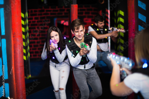 Guy and girl during laser tag game