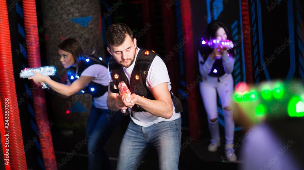 Young man on laser tag arena