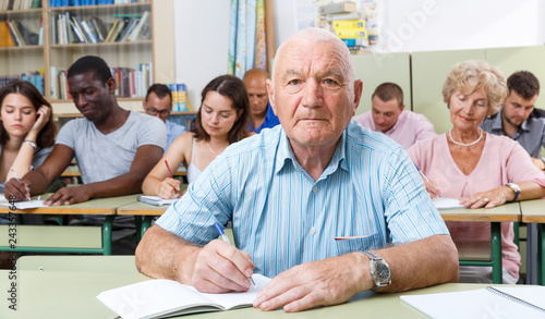 Mature man take a written exam