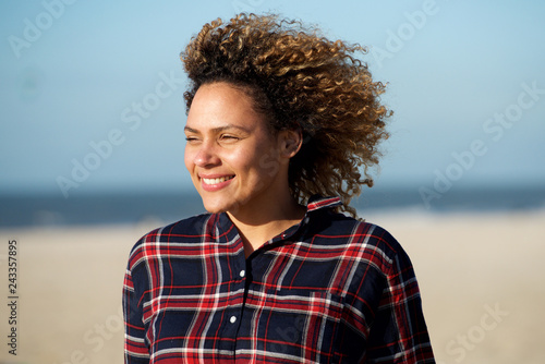 horizontal portrait attractive african american woman smiling outdoors © mimagephotos