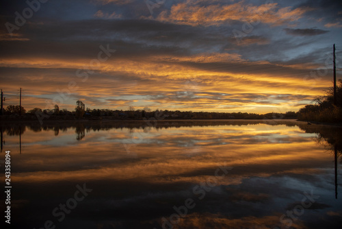 sunrise reflected over water