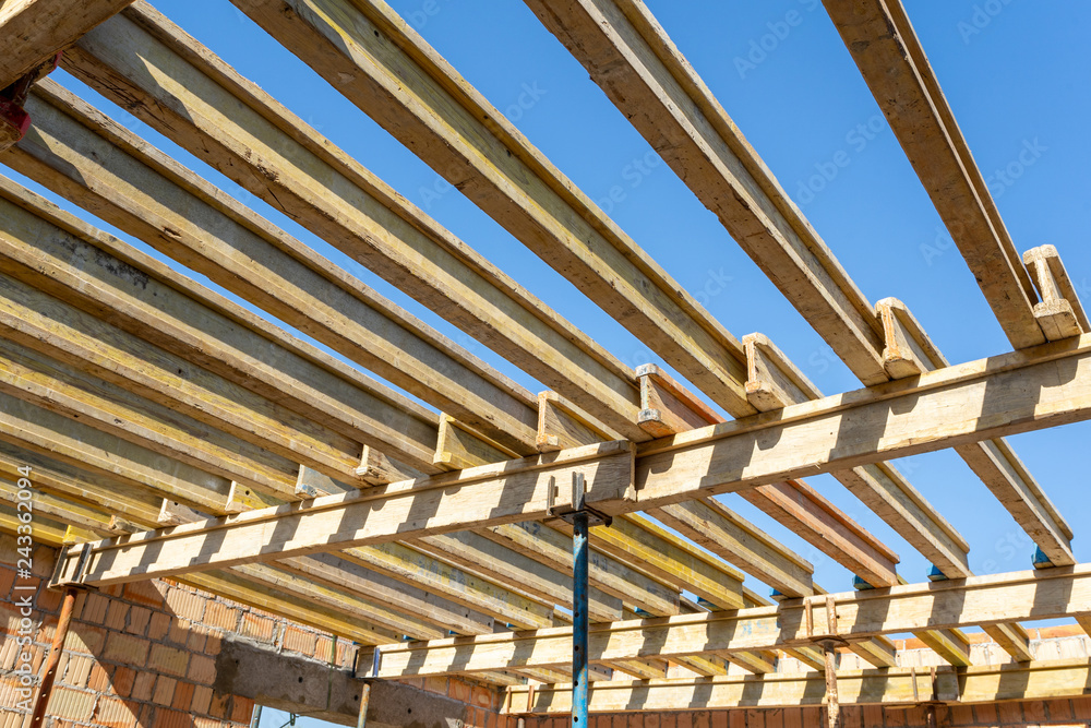 Photo of ceiling formwork construction against peaceful blue sky