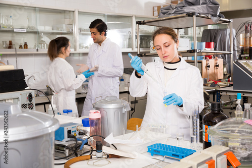 Female chemist mixing reagents