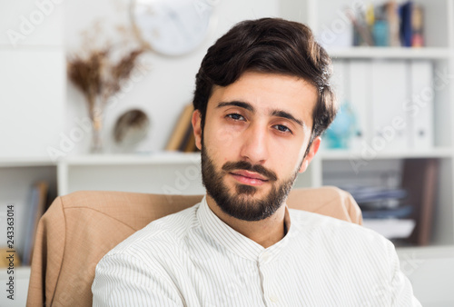 Portrait of young cheerful businessman