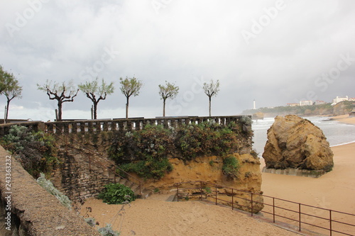 Beach pier with lighthouse