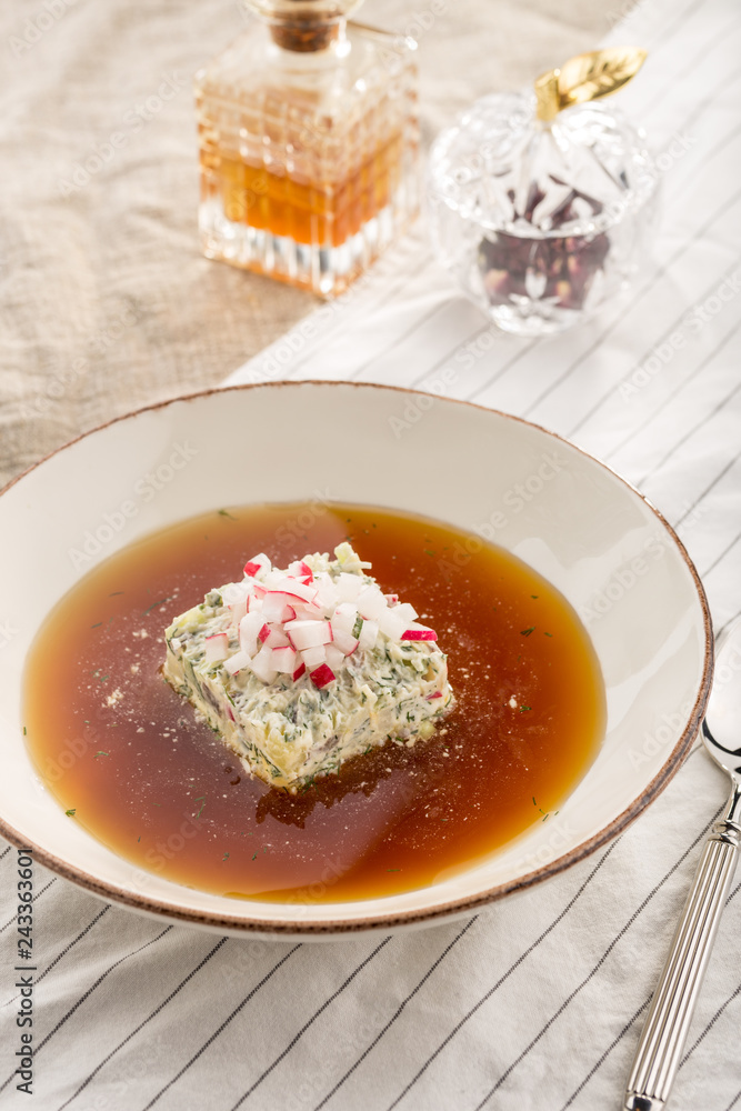 Summer cold soup okroshka with radish, cucumber and dill served on table Summer cold soup okroshka with radish, cucumber and dill served on table