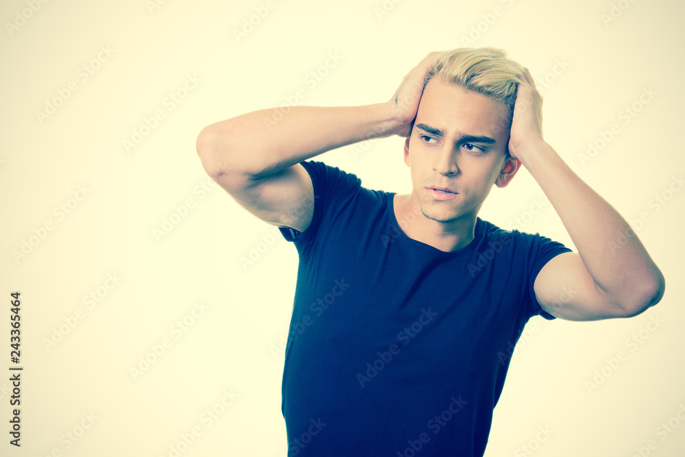 Handsome young man on an isolated background looking at camera Handsome young man on an isolated background looking at camera