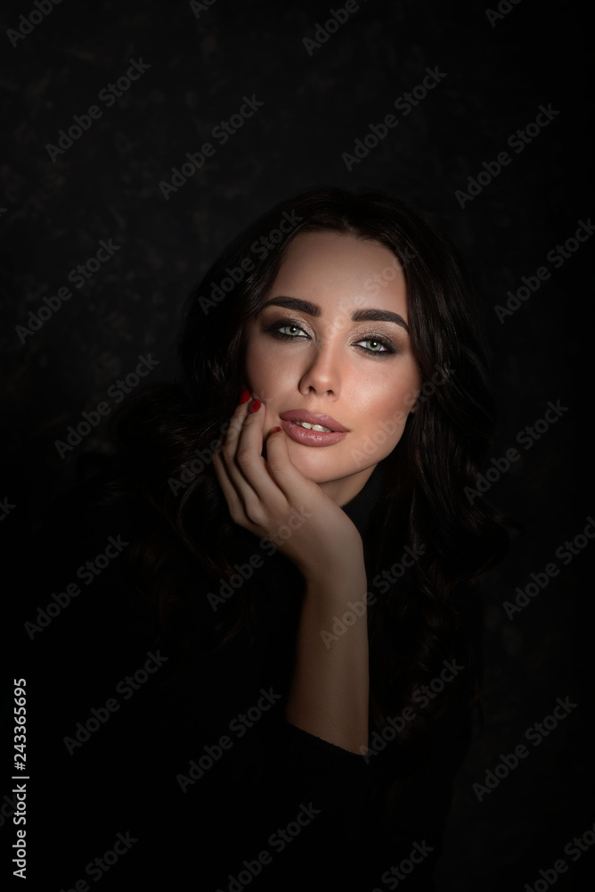 Fashion beauty trend portrait of beautiful brunette girl with long and shiny curly hair. Sexy baby faced model woman with curls hairstyle. Care and beauty of hair. Bright violet lips Fashion beauty trend portrait of beautiful brunette girl with long and shiny curly hair. Sexy baby faced model woman with curls hairstyle. Care and beauty of hair. Bright violet lips