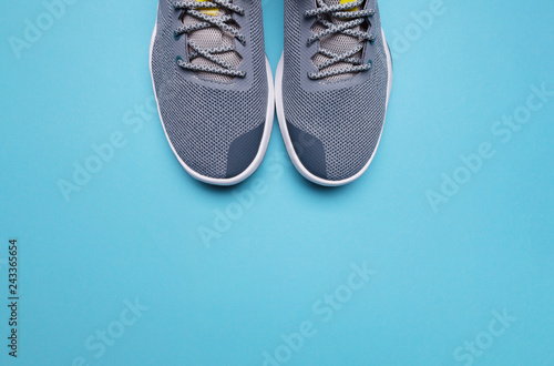 One Pair of blue sport shoes on blue background