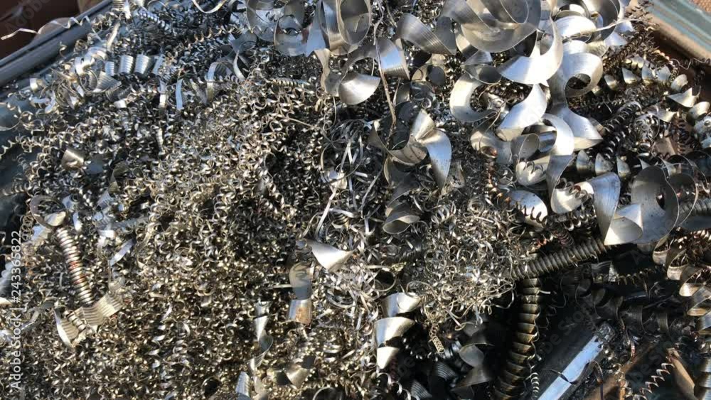 Shiny metallic background of car parts in junkyard reflecting sunlight. Shiny metallic background of car parts in junkyard reflecting sunlight.