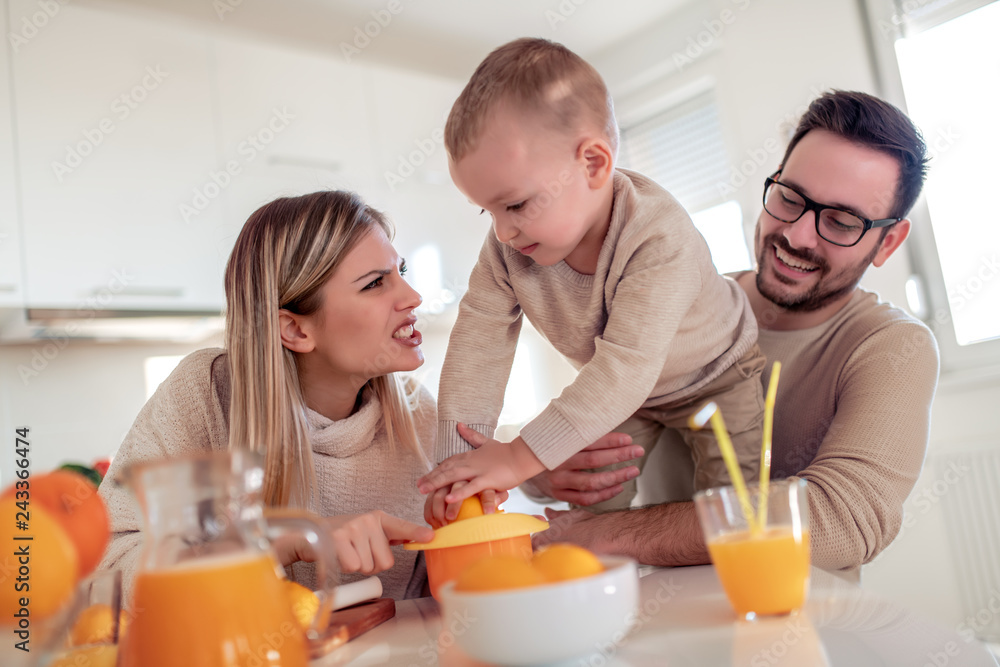 Family make fresh orange juice Family make fresh orange juice