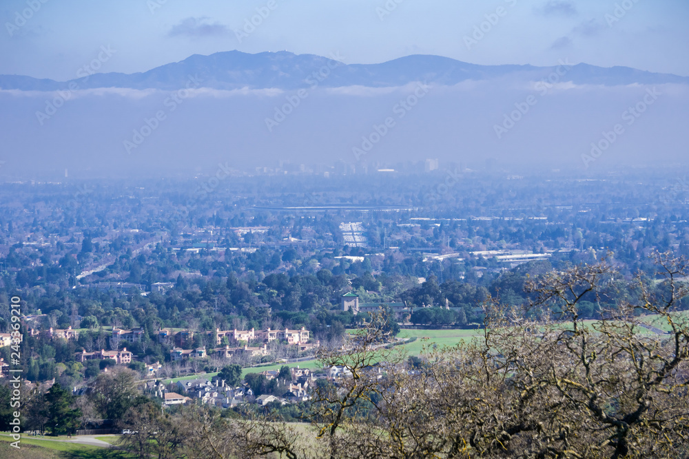Obraz premium Aerial view of Cupertino and San Jose, Silicon valley; south San Francisco bay area; Mount Hamilton summit (and the observatories) in Diablo mountain range in the background; California
