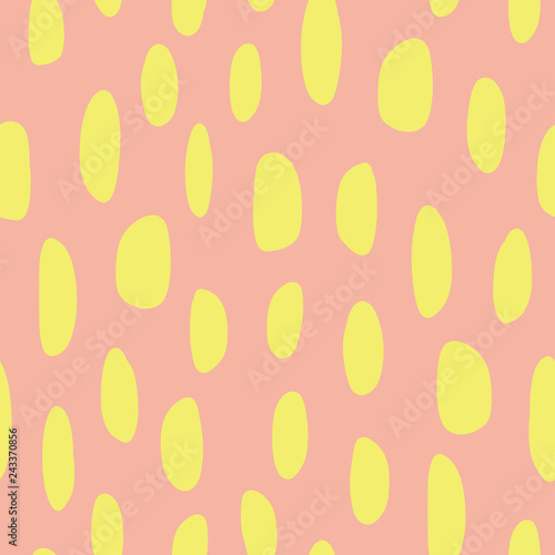 Abstract spot shapes seamless vector pattern. Yellow lime marks on coral background. Modern strokes design for fabric, packaging , digital paper, web banner, page fill, wrapping, covers