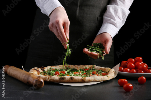 Fototapeta Naklejka Na Ścianę i Meble -  chef making pizza