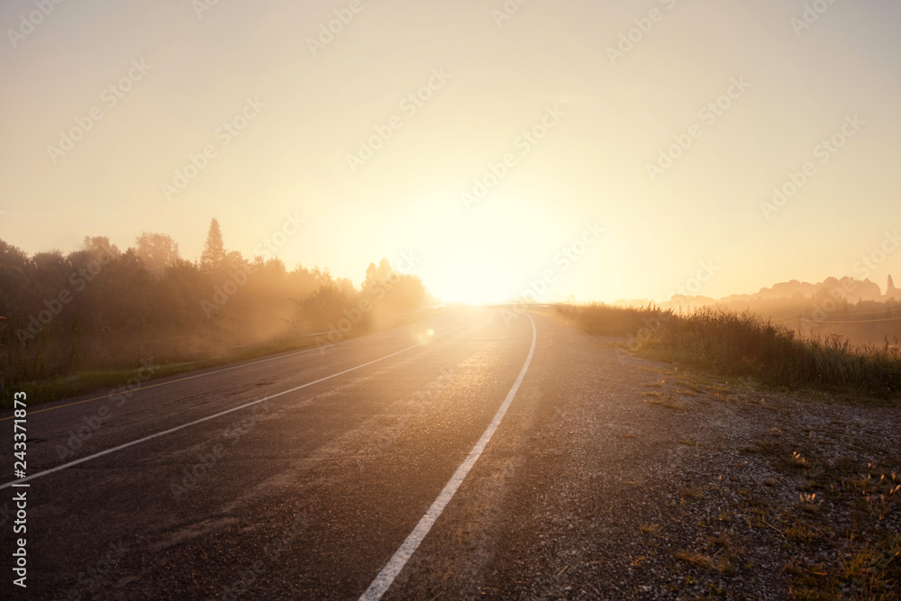 road at sunset with sunlight