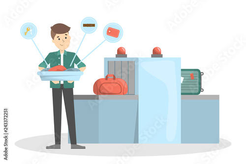 Man standing in airport at conveyor belt