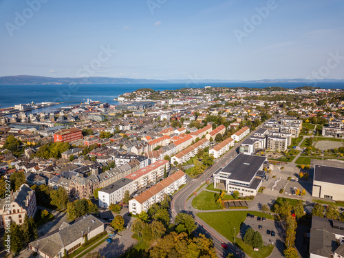 Drone Photo of the City Trondheim in Norway on Sunny Summer Day with Mountains, Fjord and Port in the Background