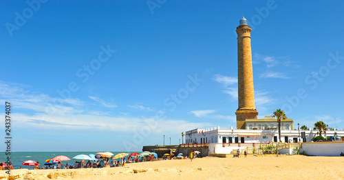 The famous beach and lighthouse of Chipiona (Faro de Chipiona) in the coast of Cadiz. The highest in Spain. photo