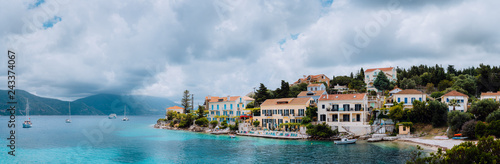 Superb scene of Fiskardo town with Zavalata Beach. Seascape of Ionian Sea on overcast day. Tranquil scene on Kefalonia island  Greece  Europe. Traveling vacation concept