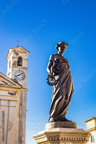 Municipal Theater Gian Lorenzo Bernini, housed in a deconsecrated church. Fountain with statue of the goddess Flora. Bell tower with clock. Ariccia, Castelli Romani, Lazio, Italy. photo