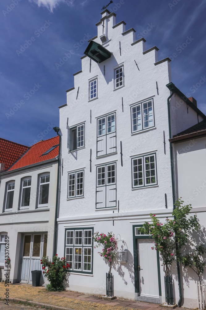 traditional gable roof house facade in the beautiful dutchman village Friedrichstadt in Schleswig Holstein
