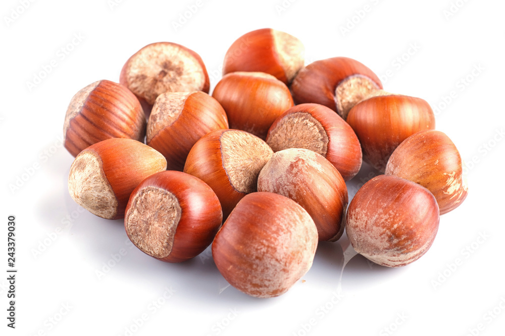 Pile of hazelnuts with shell isolated on white background. Pile of hazelnuts with shell isolated on white background.