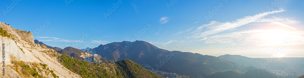 Panorama of mountains rocks and forest, town, sea and sun.